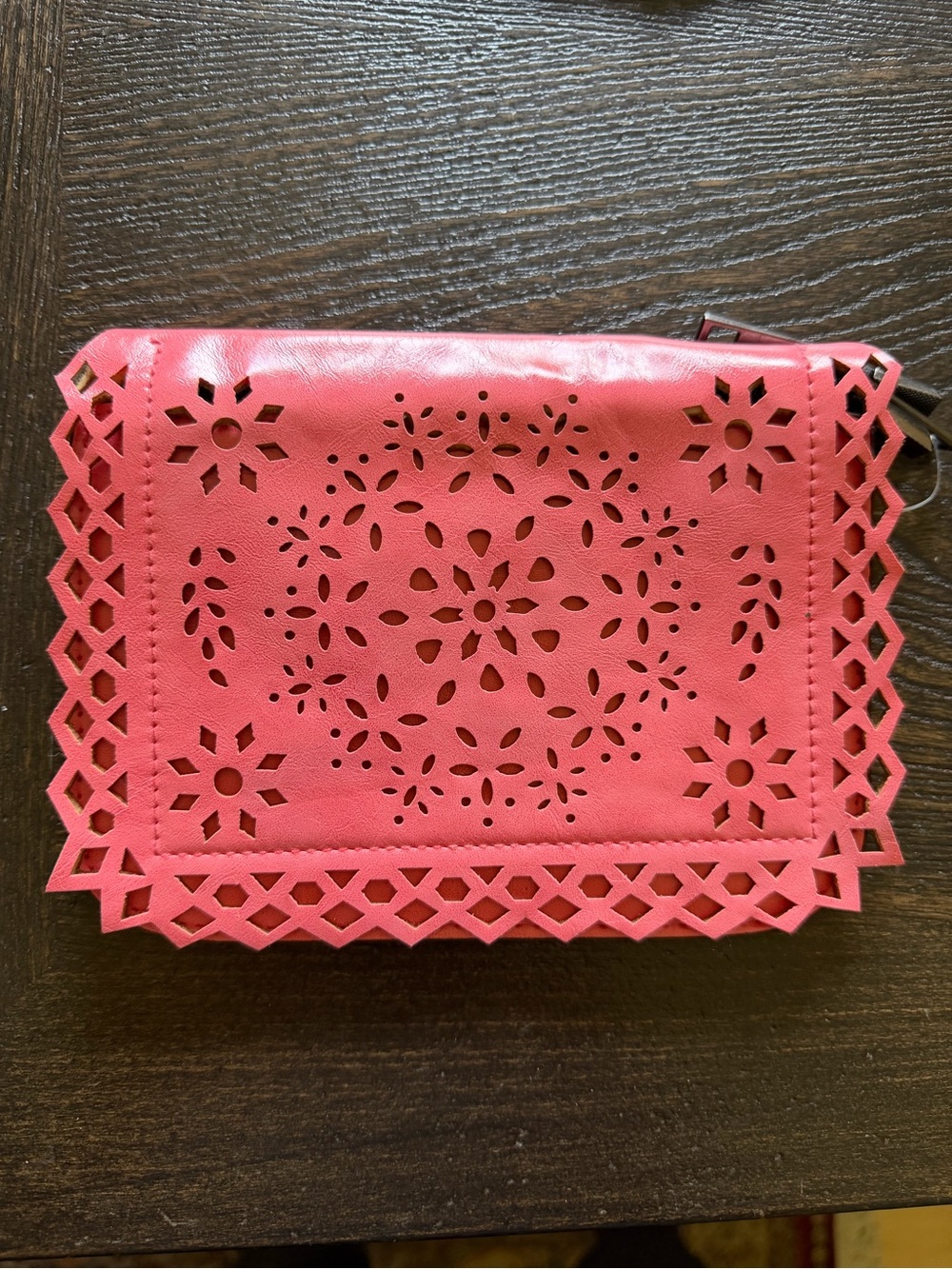 Laser-Cut Pink Wristlet Clutch with Floral Motif